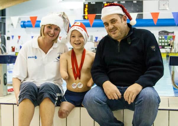 Harvey with coach Sarah and dad Darren Phillips EMN-160701-170348002