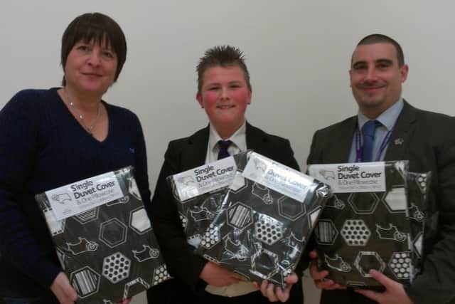 Lennee le Simpson (centre) with Ali Byerley of Derbyshire Childrens Holiday Centre (left) and Darren Price, principal of Skegness Junior Academy. ANL-160117-143405001