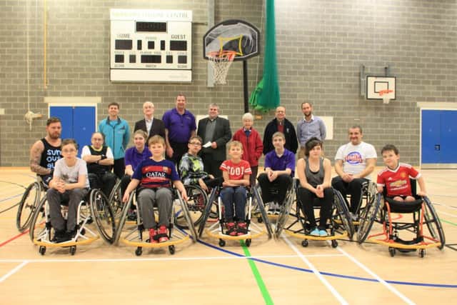 The Club with Magna Vitae, East Lindsey District Council, club Coach, and representatives from the Marian and Leslie Howe Fund
