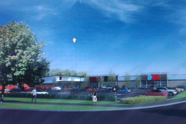 An artist's impression of the retail park, including a new Aldi supermarket, to be built on the site in Burgh Road, now occupied by Skegness Town. ANL-161101-154558001