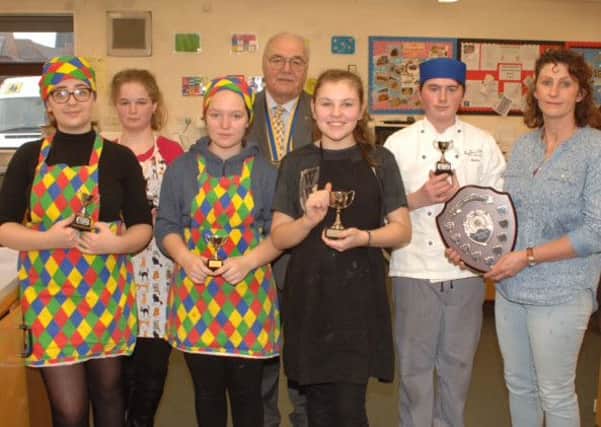 Finalists of the Rotary Club Young Chef contest for Sleaford From left - Rose Harvey, Isobel Coles, Skie Humphry, John Elkington - President of the Rotary Club of Sleaford, Mollie Sheppard - winner, Kurtis Wright - runner up and food tech teacher at Kesteven and Sleaford High School,  Julie Pankhurst. EMN-160118-150927001