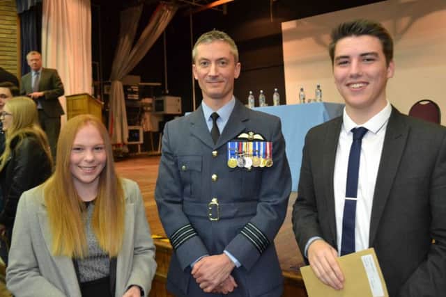 Twins Emily and Joseph Haggo receiving their GCSE certificates.