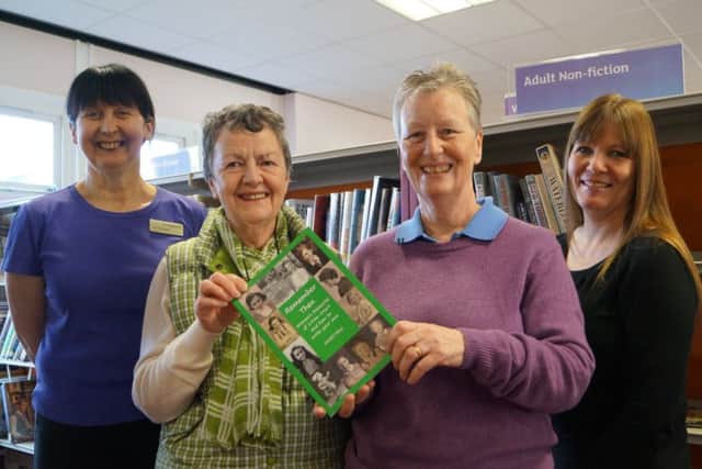 Stephanie Fox, left, and Hazel Barnard with the book donated to Market Rasen Library EMN-160113-222934001