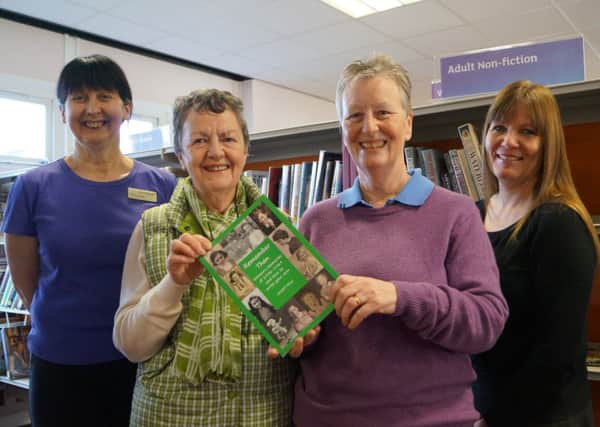 Stephanie Fox, left, and Hazel Barnard with the book donated to Market Rasen Library EMN-160113-222934001