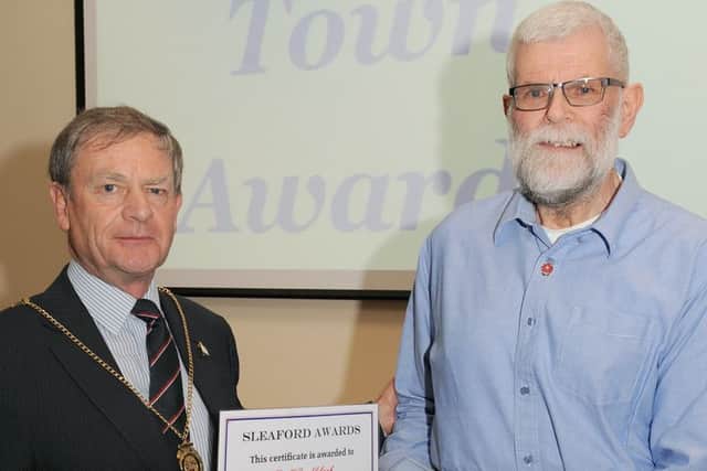Mayor of Sleaford Garry Titmus presents the award to Sleafordian of the Year Geoff Brocklebank. EMN-160114-165458001