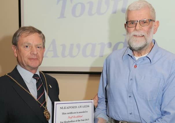 Mayor of Sleaford Garry Titmus presents the award to Sleafordian of the Year Geoff Brocklebank. EMN-160114-165458001