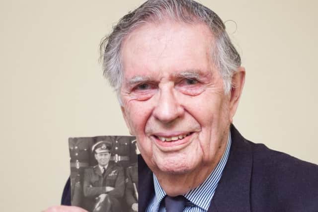 Coun Geoffrey Whittle with a picture of him with his 101 Squadron Bomber Command crew. EMN-160115-152000001