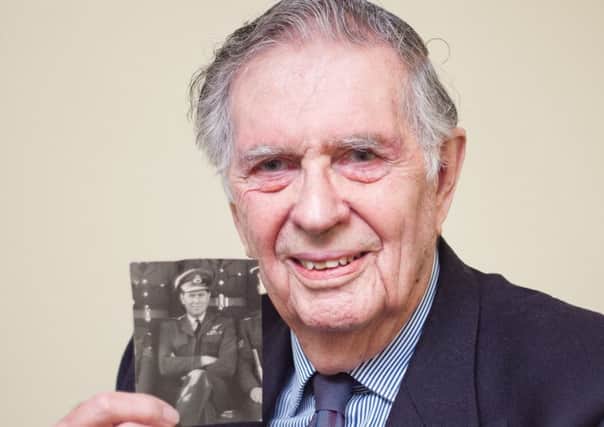 Coun Geoffrey Whittle with a picture of him with his 101 Squadron Bomber Command crew. EMN-160115-152000001