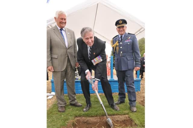 Coun Geoffrey Whittle digging the first turf for the new Bomber Command memorial at Lincoln. EMN-160115-153928001