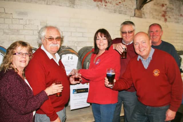 Brigg Lions celebrating at the 2015 Beer Festival. Now President Dawn Gillman (centre right) and Brian Marshall centre left have launched several initiatives for 2016. EMN-160119-161444001