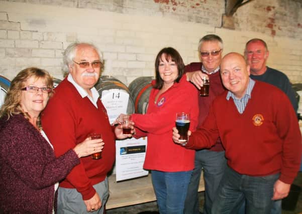 Brigg Lions celebrating at the 2015 Beer Festival. Now President Dawn Gillman (centre right) and Brian Marshall centre left have launched several initiatives for 2016. EMN-160119-161444001