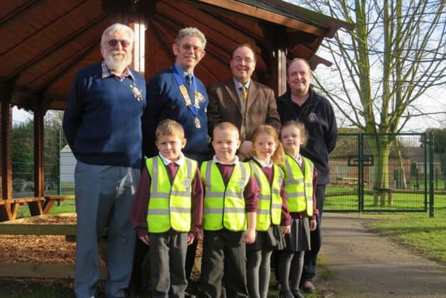 Kelsey Primary head teacher Magnus Smedley with Class Two children Tilly, Alfie, Rosa and Mattie receiving their vests from Lions President Ron Lyus (with chain), Zone Chair Reg Hunt and Lions Youth Officer Martyn Kemp. EMN-160122-072630001