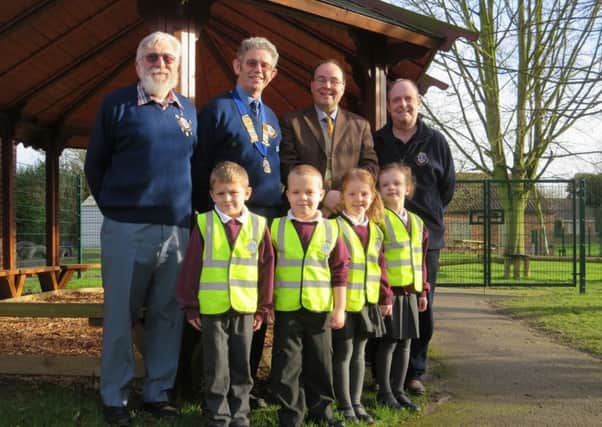 Kelsey Primary head teacher Magnus Smedley with Class Two children Tilly, Alfie, Rosa and Mattie receiving their vests from Lions President Ron Lyus (with chain), Zone Chair Reg Hunt and Lions Youth Officer Martyn Kemp. EMN-160122-072630001
