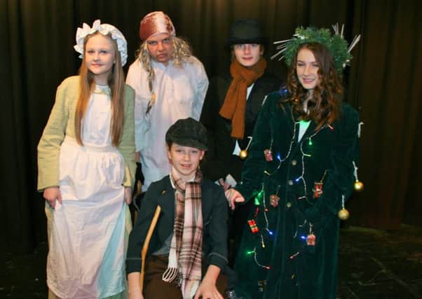 Stars of Scrooge, the annual production at The Vale Academy: from the left (rear)-Millie Tucker as Mrs Cratchit, Daniel Smith as Scrooge, Aric Tompkinson as Bob Cratchit, Katie Bolton-Smith as The Ghost of Christmas Present. Front-Jessica Piers as Tiny Tim. EMN-160119-161339001