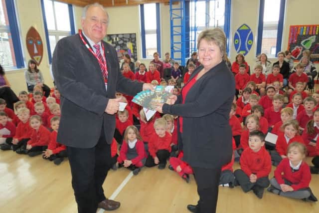 Rotarian Neil Taylor and Middle Rasen head teacher Melonie Brunton EMN-160122-080719001