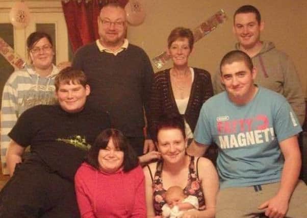 Liam Coughlin (back row right) pictured next to his mum and dad, Beverley and Malcolm, and other members of the family and friends. ANL-160126-092033001