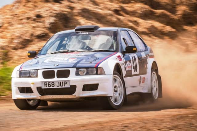 Ady Warrant and Clare Law at speed in their BMW.