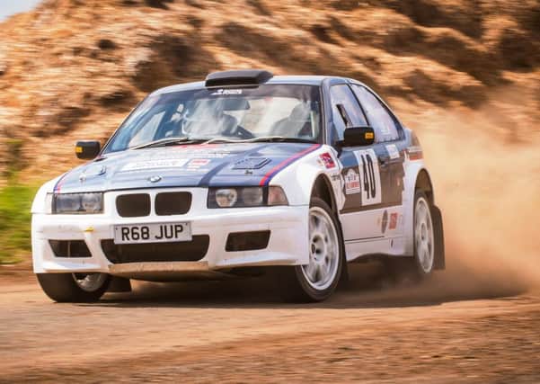 Ady Warrant and Clare Law at speed in their BMW.
