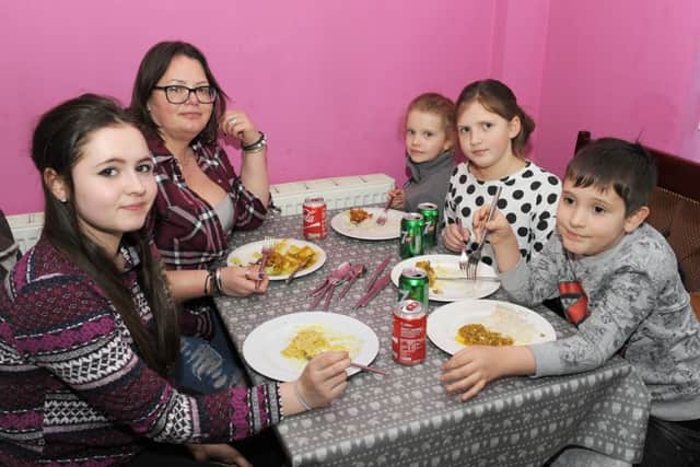 Boston Muslim Community celebrating birth of Prophet Mohammed, offering free food at Massala Zone and raising money for charity. L_R Elizabeth Pearson 16, Trisha Pearson, Emily Kruz 5, Victoria Pearson 9, Arthur Pearson 8.