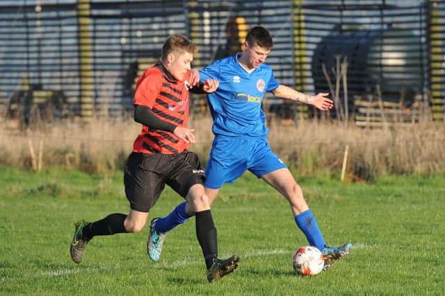 Tom Dunworth and Adam Coulan do battle as Leverton beat Wrangle.