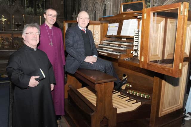 Bishop of Grantham blessing newly recommissioned organ at Heckington St Andrew's Church. L-R Rev Chris Harrington, The Revd Dr Nicholas Chamberlain - Bishop of Grantham, John Lyon - organist. EMN-160119-115847001