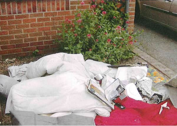 Items dumped by Michael Peter Hutchinson, most recently living at Church Lane, Croft, Skegness, in his ex-wife's front garden. EMN-160120-132713001