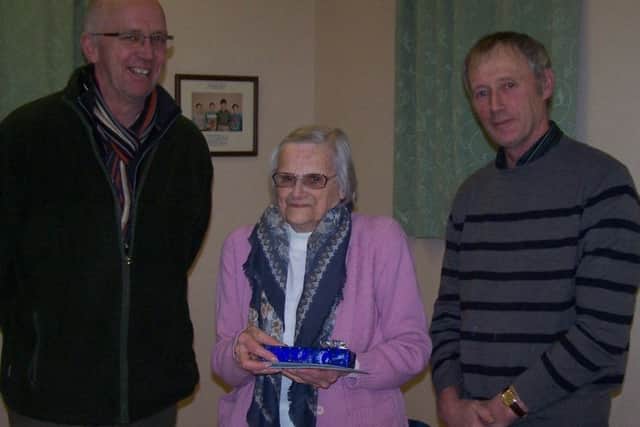 Retiring clerk to Firsby Group Parish Council Eileen Bark with Coun Craig Leyland, leader of East Lindsey District Council (left) and Coun Richard Kidd, parish council chairman. ANL-160121-173734001