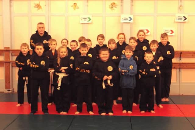 The juniors take stock of their new kit.