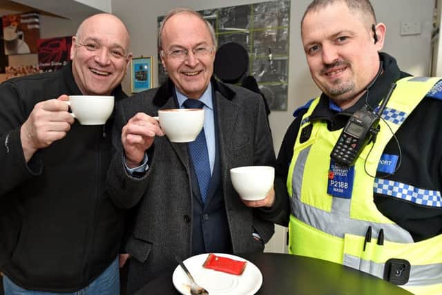 Alan Hardwick (centre) has vowed to retain all 1,100 frontline officers in the country.