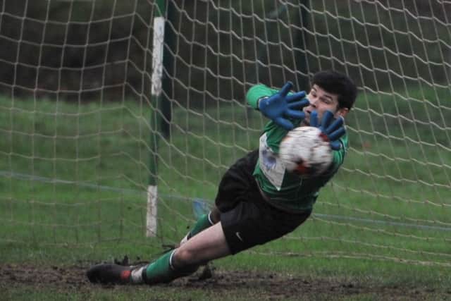 Market Rasen goalkeeper Will Bradford saves Richard Jackson's penalty EMN-160125-112315002