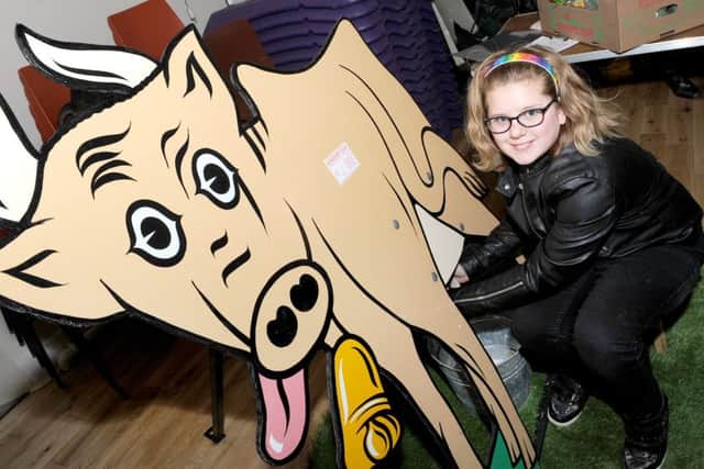 Boston Town Team's first event, Local Food For Thought. Heather Bligh 12 of Boston milking the cow.