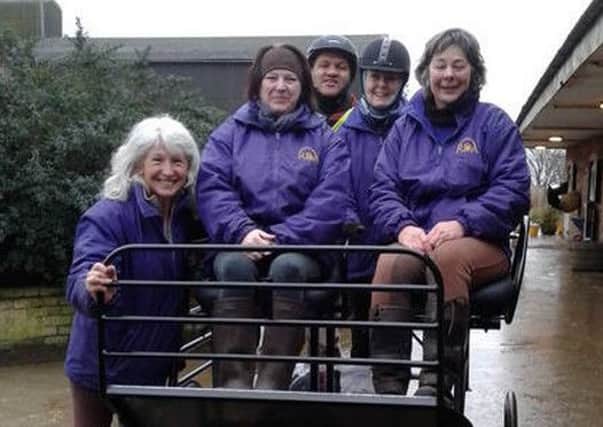 Members of the Lincolnshire Riding for Disabled group pictured with the new carriage.