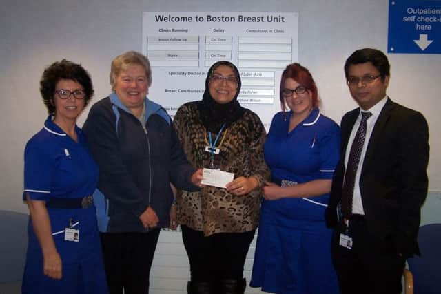 Wendy Holmes (second left) presenting a cheque for £400 to the breast cancer care unit at Pilgrim Hospital in Boston. ANL-160122-163013001