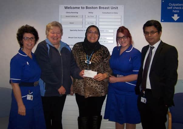 Wendy Holmes (second left) presenting a cheque for Â£400 to the breast cancer care unit at Pilgrim Hospital in Boston. ANL-160122-163013001