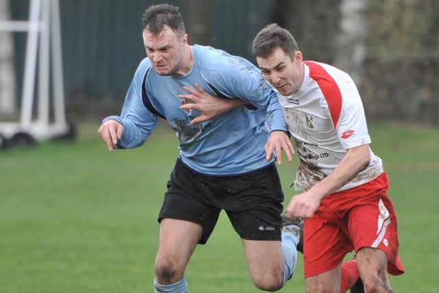 Rasen skipper Joe Osbourne (right) contests possession with Horncastle's Nathan Radon. EMN-160125-112325002