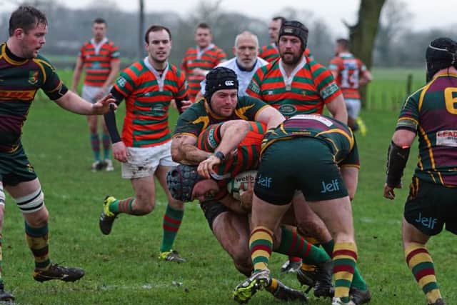 Christian Mills tries to punch a hole through the Old Laurentians defence