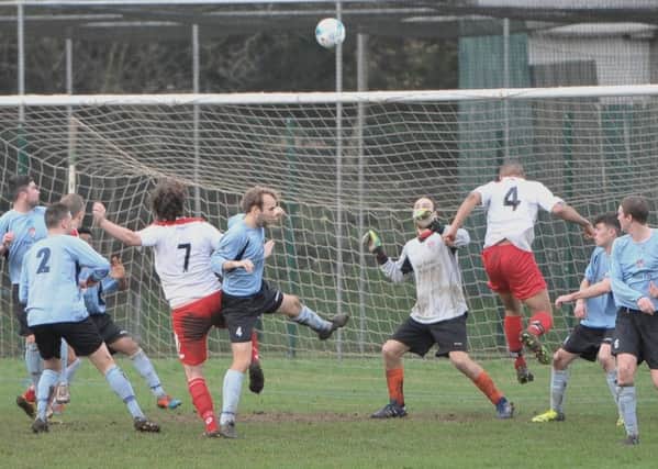 Goalmouth action during the game between Horncastle Town (blue shirts) and Market Rasen Town. Photo: Nigel West