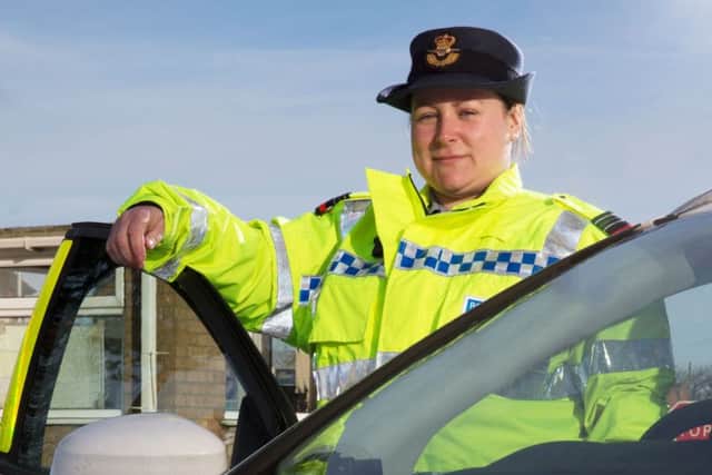 Flit Lt Sara Daunton with one of her vehicles at Royal Air Force Coningsby. EMN-160125-152102001