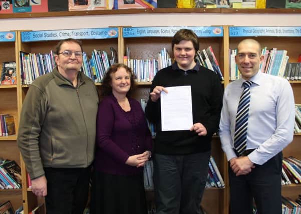 Cameron Marnoch with his parents, Doug and Kate, and Cordeaux's Assistant Vice Principal Stewart West.