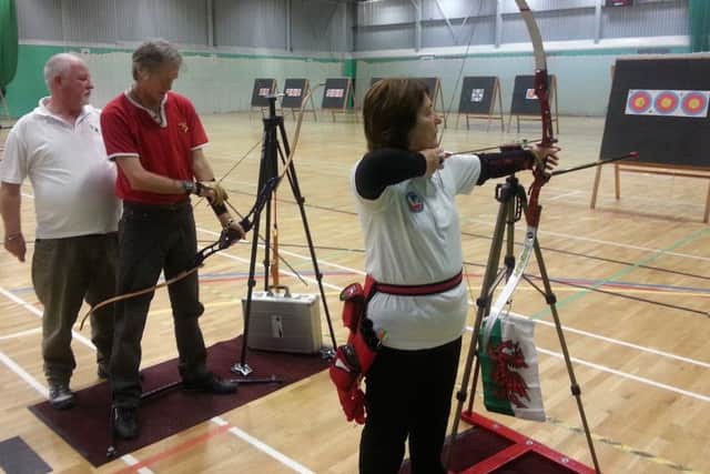 Louth and District Disabled Club chairman Rick Smith with Stuart Rodgers and Carol Davies Picture: Archery GB EMN-160128-173943002