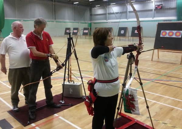 Louth and District Disabled Club chairman Rick Smith with Stuart Rodgers and Carol Davies Picture: Archery GB EMN-160128-173943002