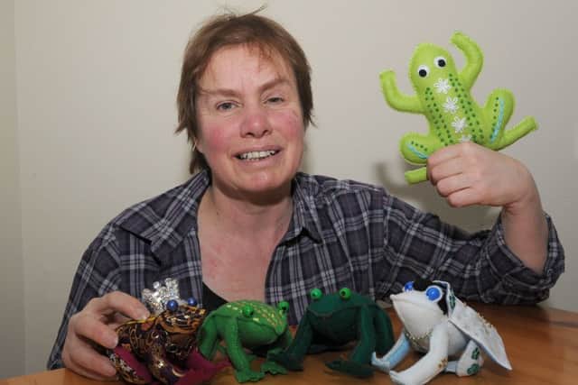 Toads Galore workshop at Coffee Corner, Swineshead. One of the artists running workshops, Julie Willoughby with toads she has made. EMN-160802-095007001