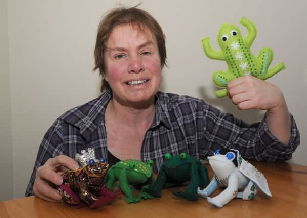 Toads Galore workshop at Coffee Corner, Swineshead. One of the artists running workshops, Julie Willoughby with toads she has made. EMN-160802-095007001