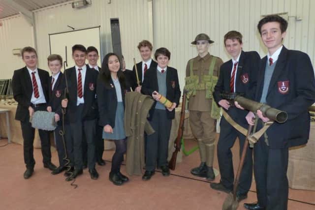 Year nine students at Caistor Grammar School with some of the artifacts brought in by Andrew Spooner.  (Lin) EMN-160202-113238001