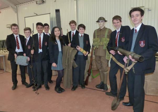 Year nine students at Caistor Grammar School with some of the artifacts brought in by Andrew Spooner.  (Lin) EMN-160202-113238001