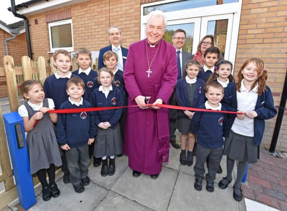 The Bishop of Lincoln performs the opening ceremony of the new hall at Kirkby on Bain Primary School EMN-160302-155416001