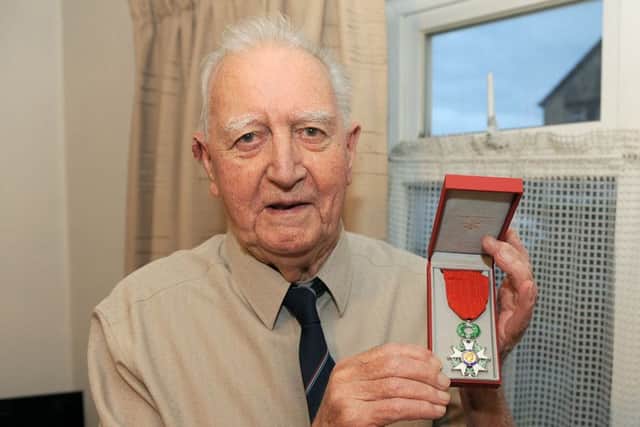 92 year old Normandy Veteran Eric Ingham, pictured with his medal.