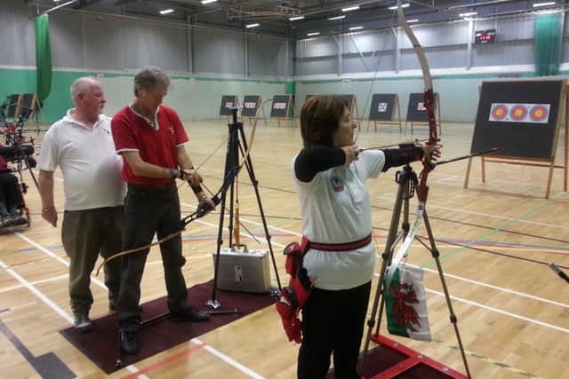 Louth and District Disabled Archery Club chairman Rick Smith with Stuart Rodgers and Carol Davies Picture: Archery GB EMN-160128-173943002