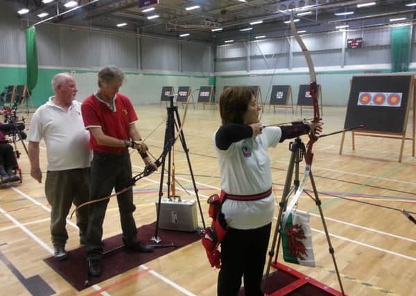Louth and District Disabled Archery Club chairman Rick Smith with Stuart Rodgers and Carol Davies Picture: Archery GB EMN-160128-173943002
