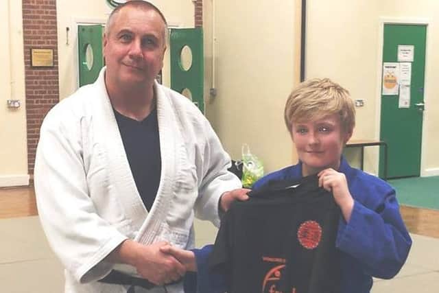 Lewis Grace with club Sensei Mark Mason. IyPnkXCeJLQDldACXo7F